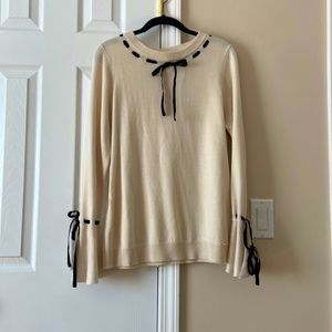 Ivanka Trump beige color blouse. Flares at the wrist.